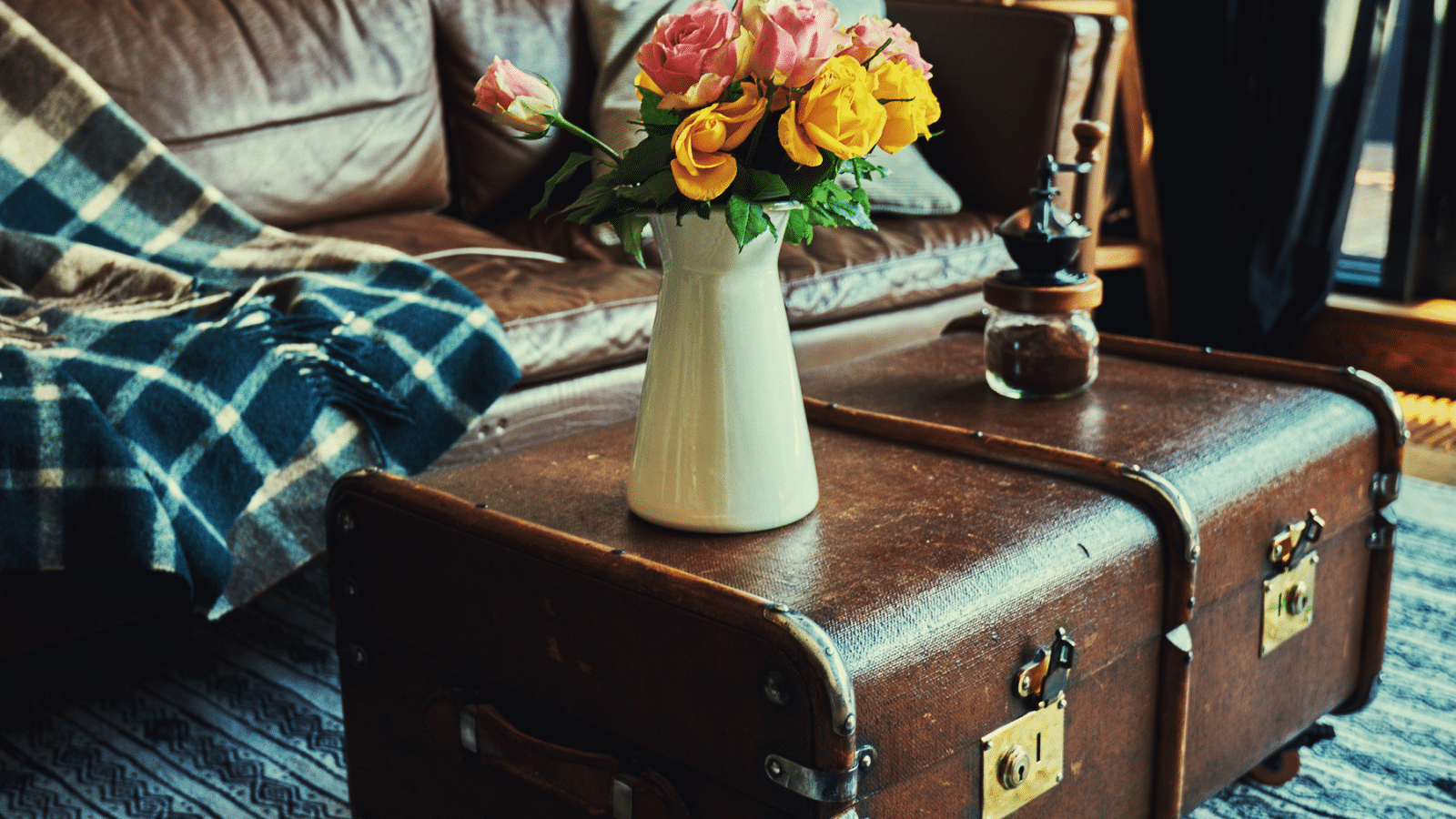 Trunks being used as tables in a living room.