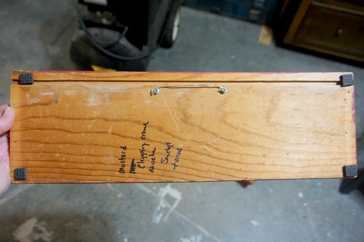 add a wire hanger and foam wall protectors to a wood sign