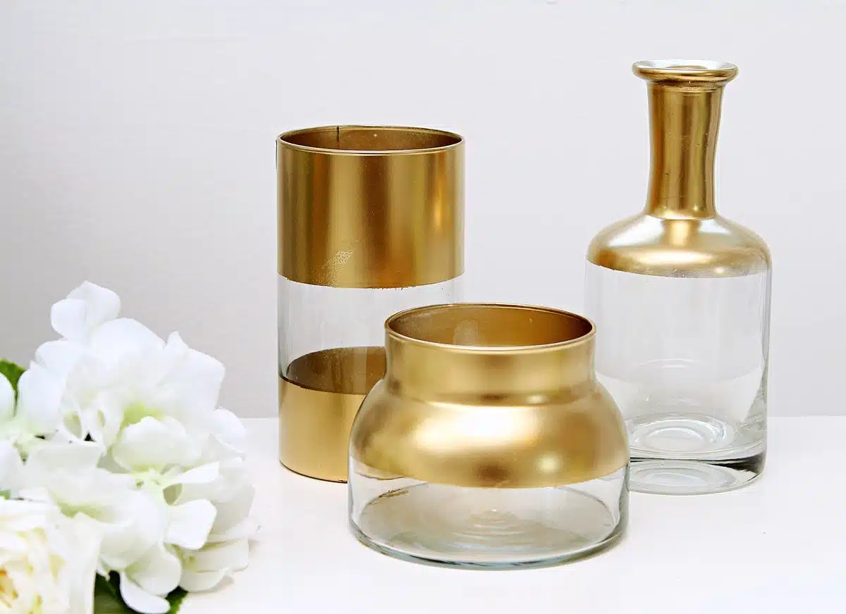clear vases spray painted with Rustoleum metallic gold paint