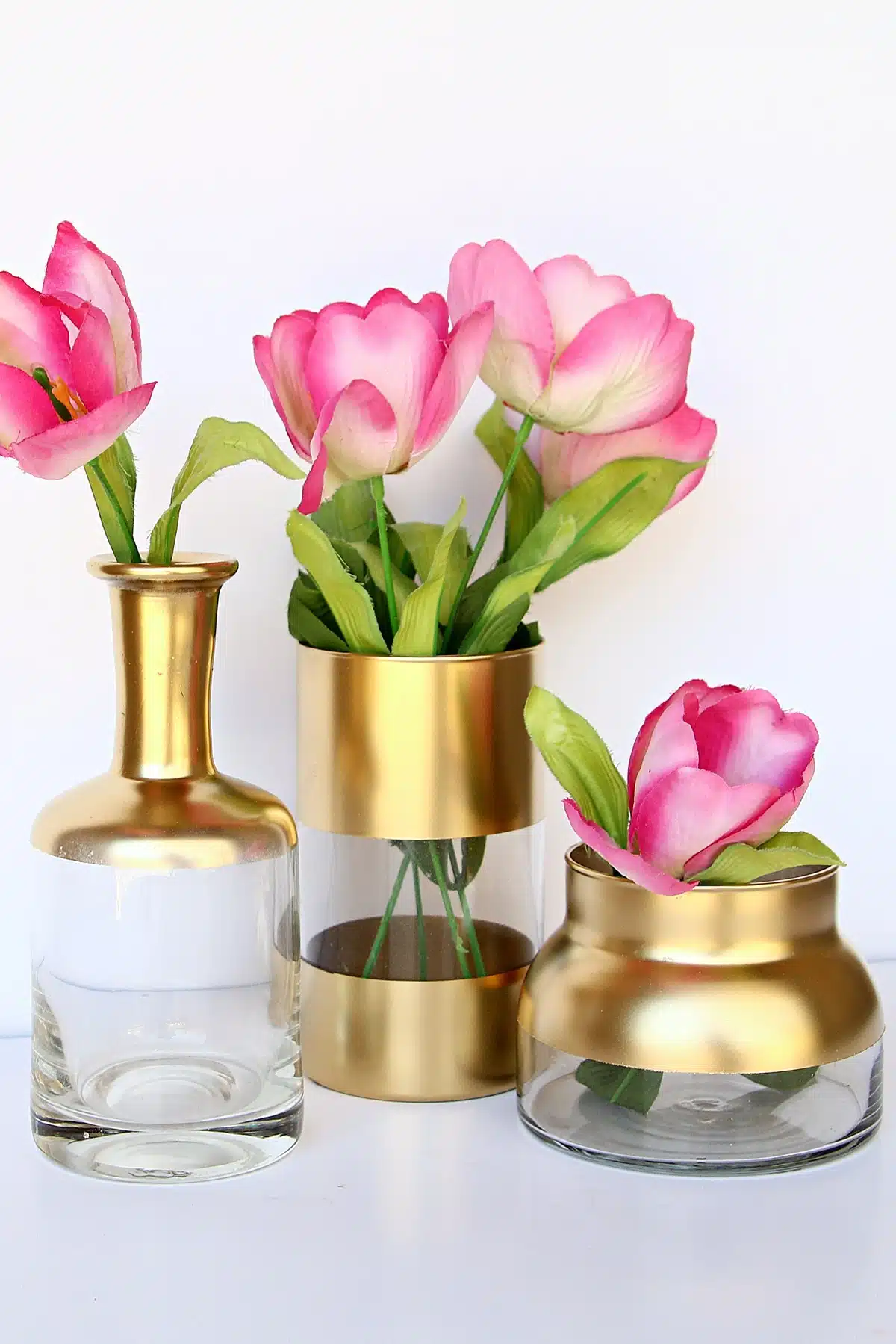spray painted vases with pink tulips