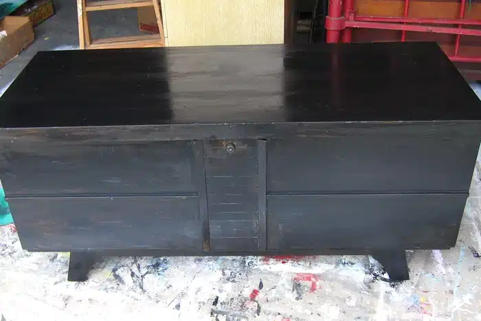 layer black and green paint on furniture with Petroleum Jelly