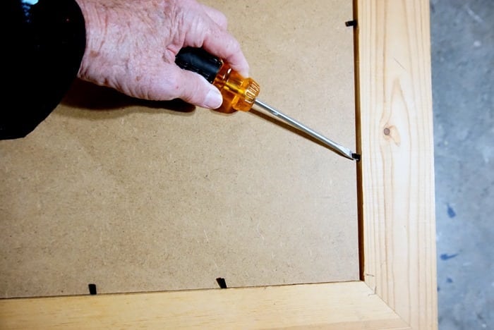 remove glass or cardboard from a photo frame