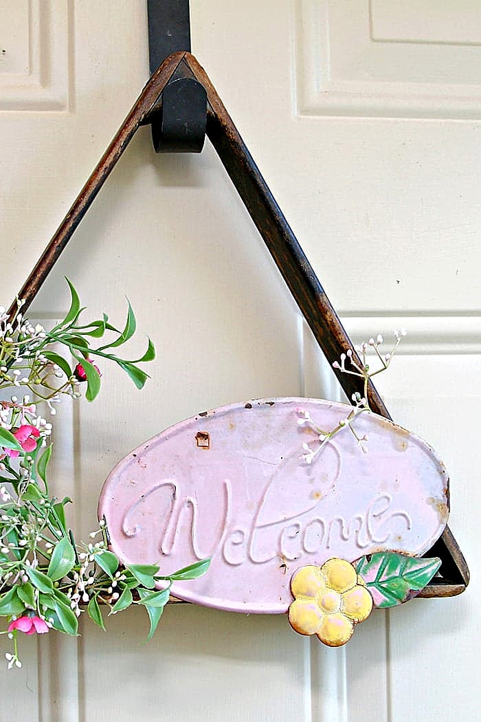 billiard ball rack repurposed into a welcome wreath
