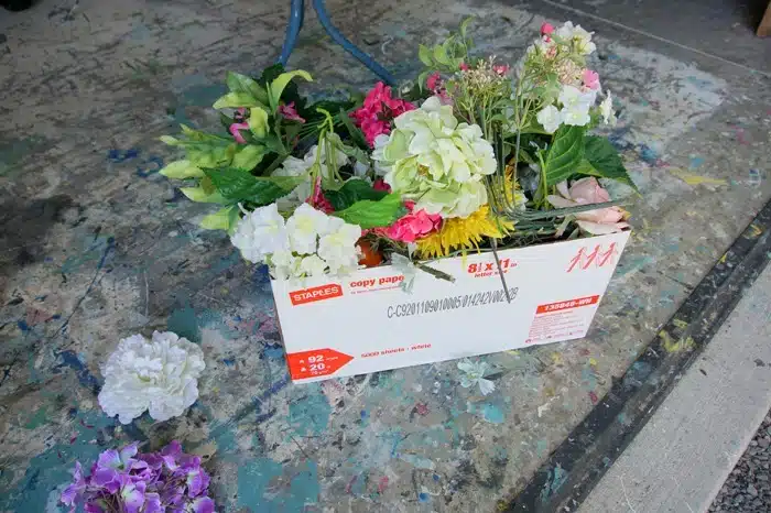 box of artificial flowers for crafting