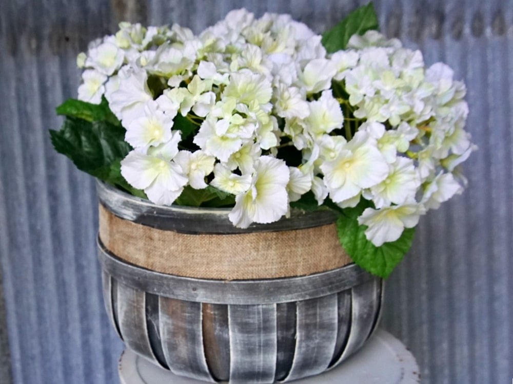 painted basket with artificial flowers