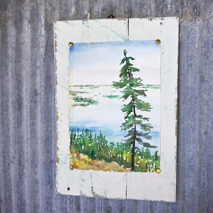 thrift store painting on reclaimed wood