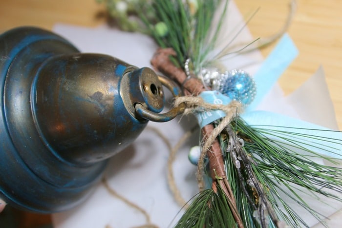 making a hanging Christmas bell with greenery