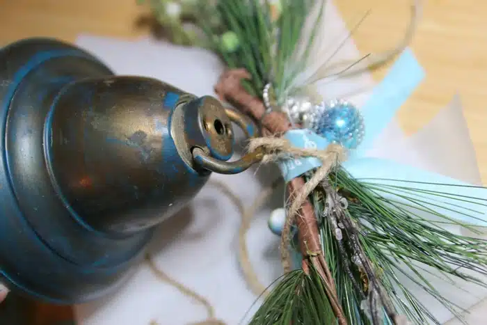 making a hanging Christmas bell with greenery