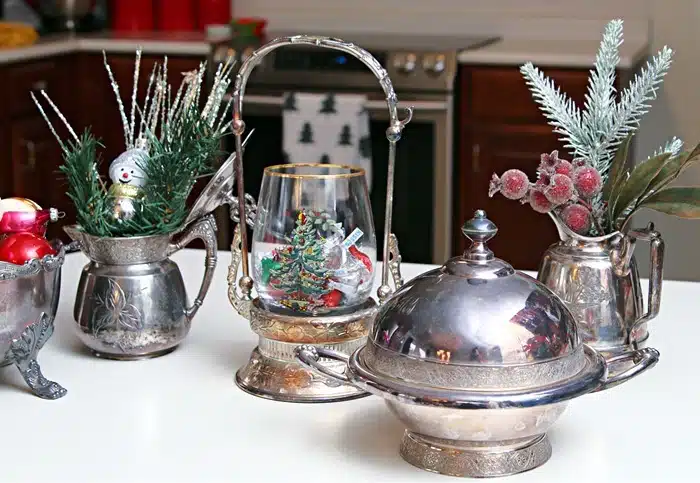 add greenery to silver plate dishes to make a pretty display