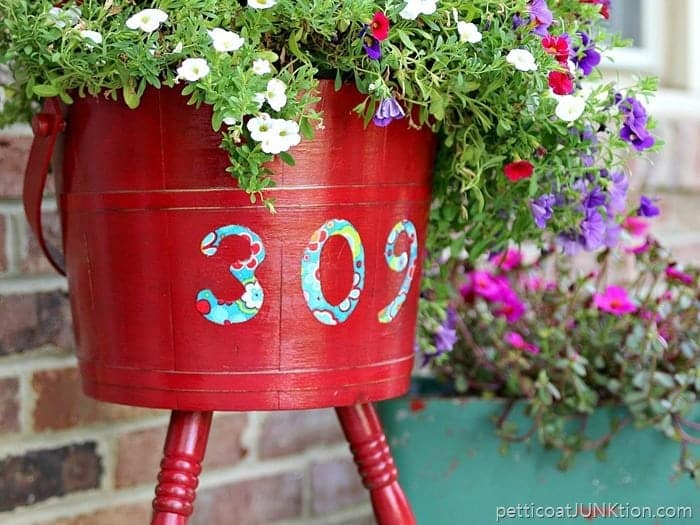 DIY upcycled wood planter with address numbers on the side