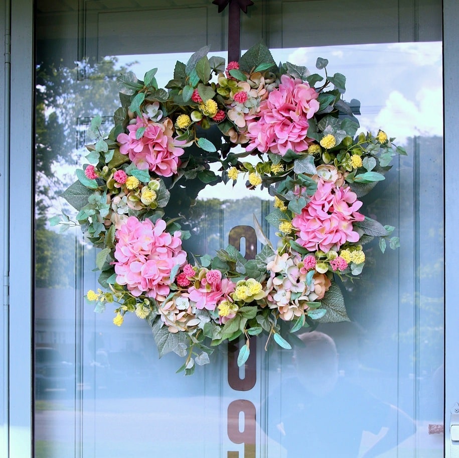 how to add flowers to a thrift store wreath to make it pretty