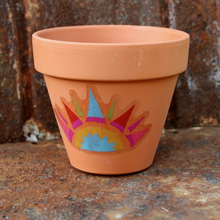 terra cotta clay flower pot with Dollar Tree decal