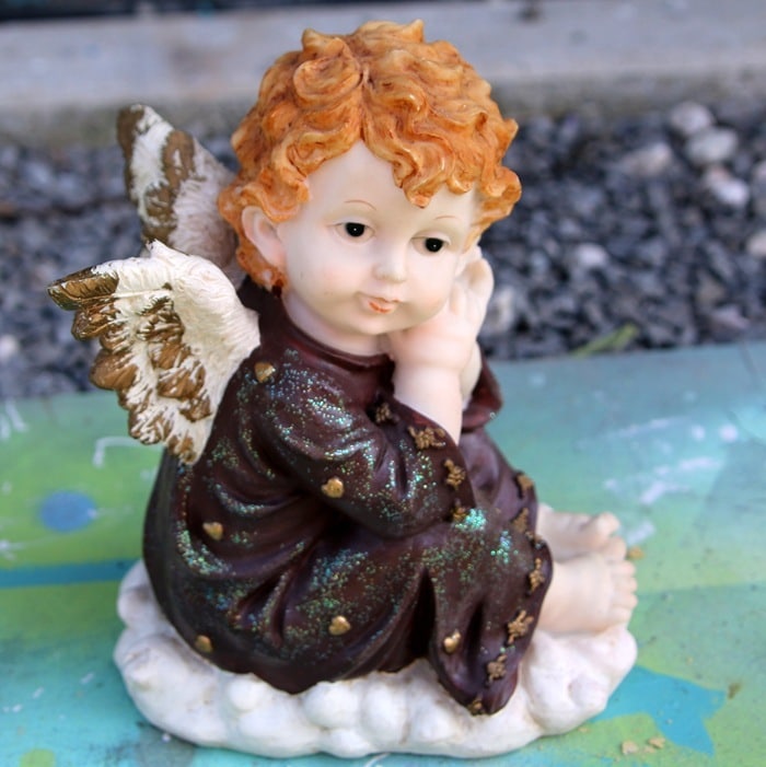 outdated cherub statue