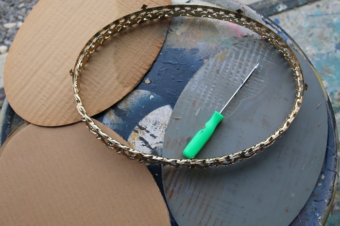removing the back from a vintage vanity tray for spray painting