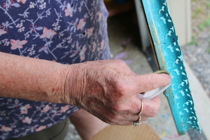 rub gold gilding wax onto home decor