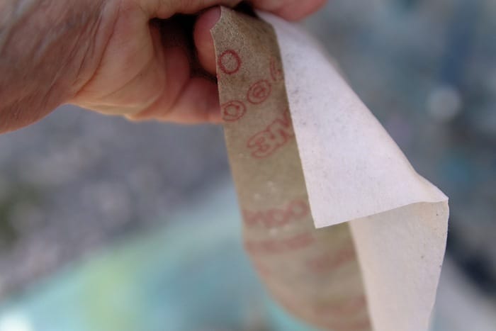 distress painted furniture with wet wipes and sandpaper