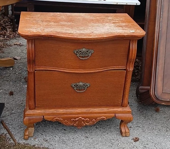 damaged wood nightstand
