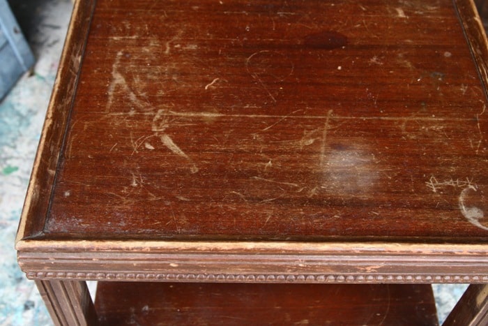 small table with damage to the finish