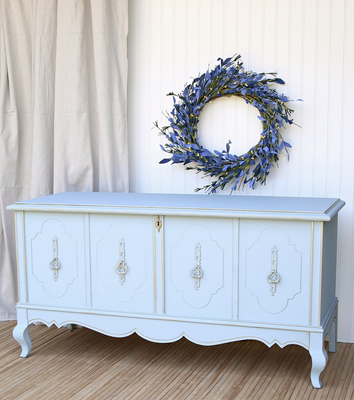 painted cedar chest with painted hardware in blue and gold