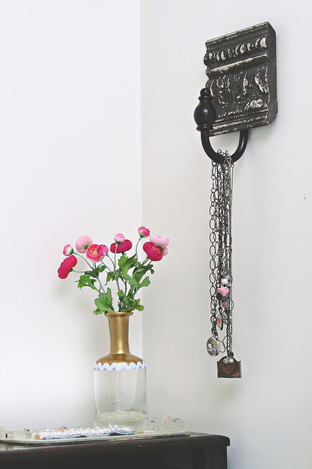 how to repurpose drapery holdbacks into a wall hanger
