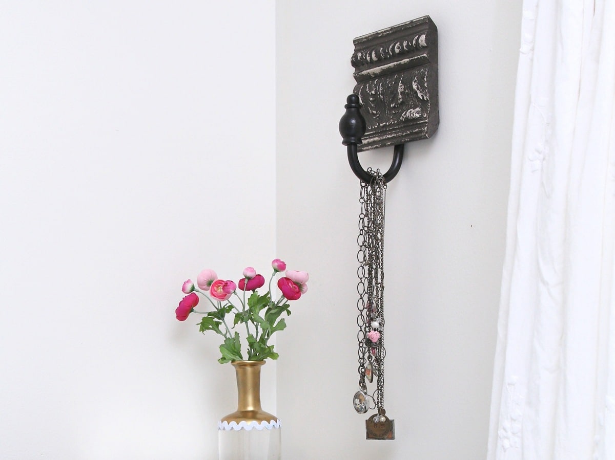 how to upcycle a curtain pullback or holder into a wall hanger