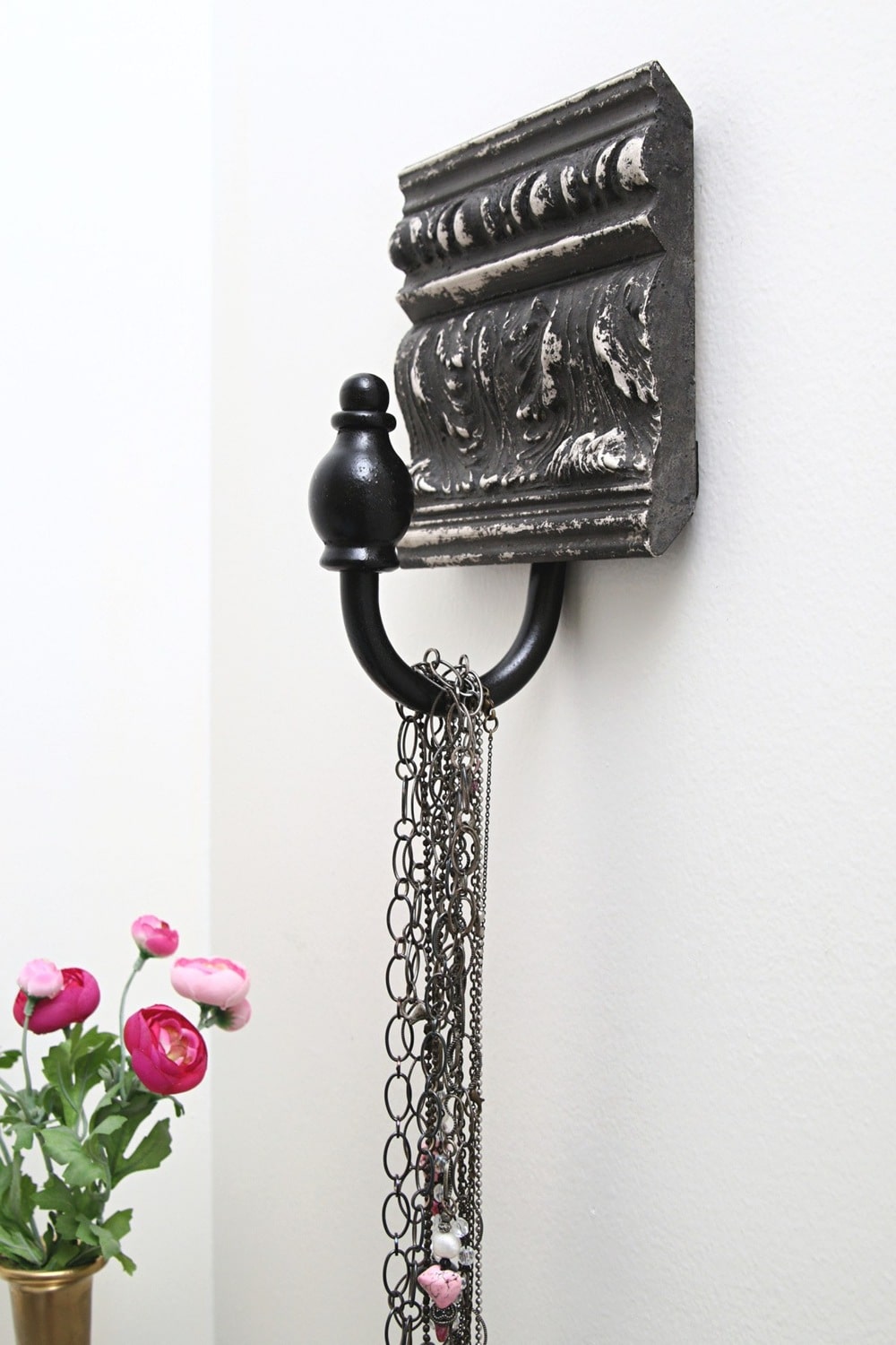 make a wall hanger with recycled wood molding trim and curtain holdbacks