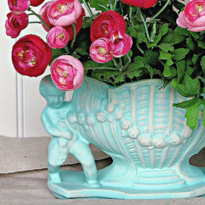 white paint dry brushed an aqua color planter