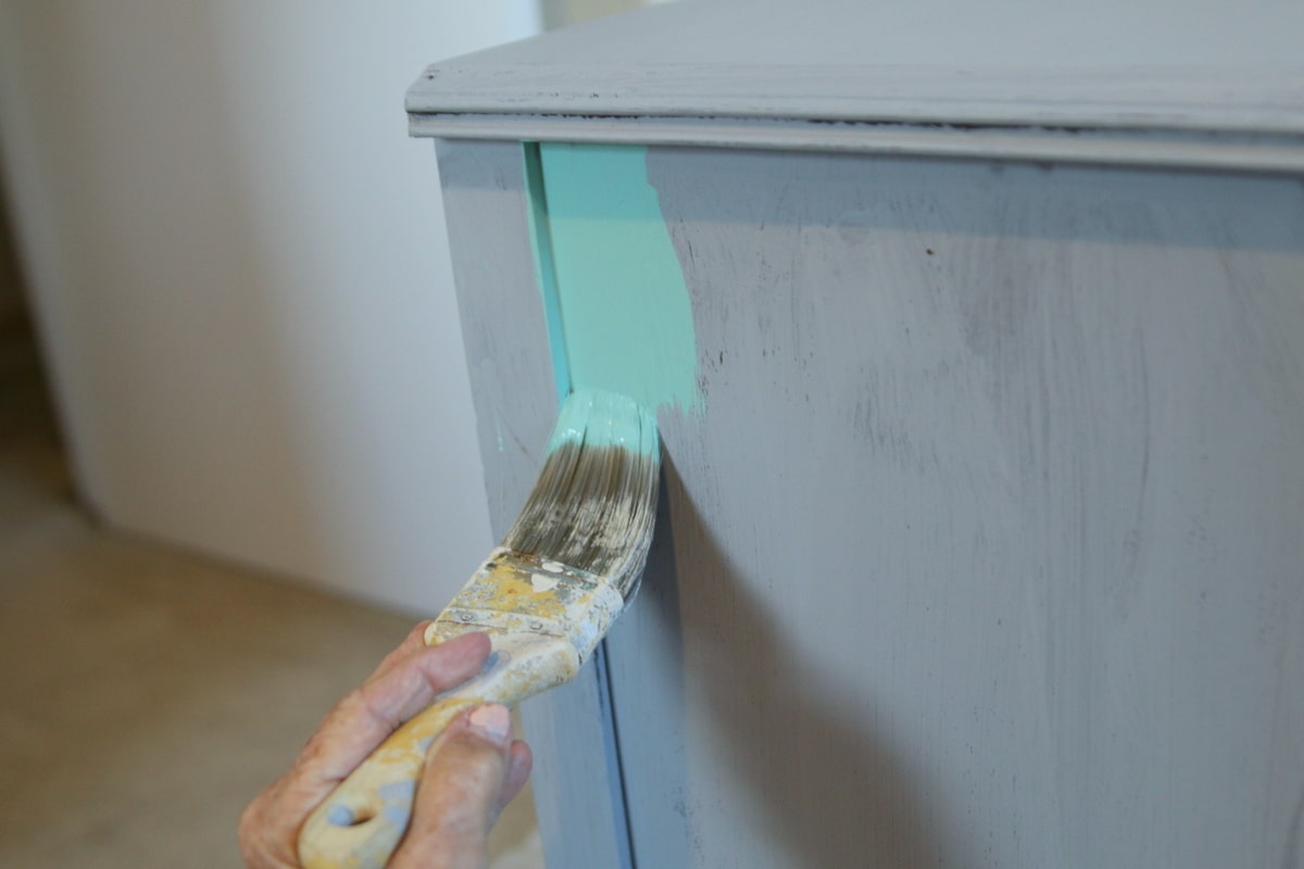 applying first coat of paint to furniture (4)