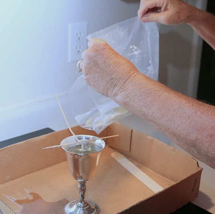 how to pour melted wax from a plastic bag into the candle container