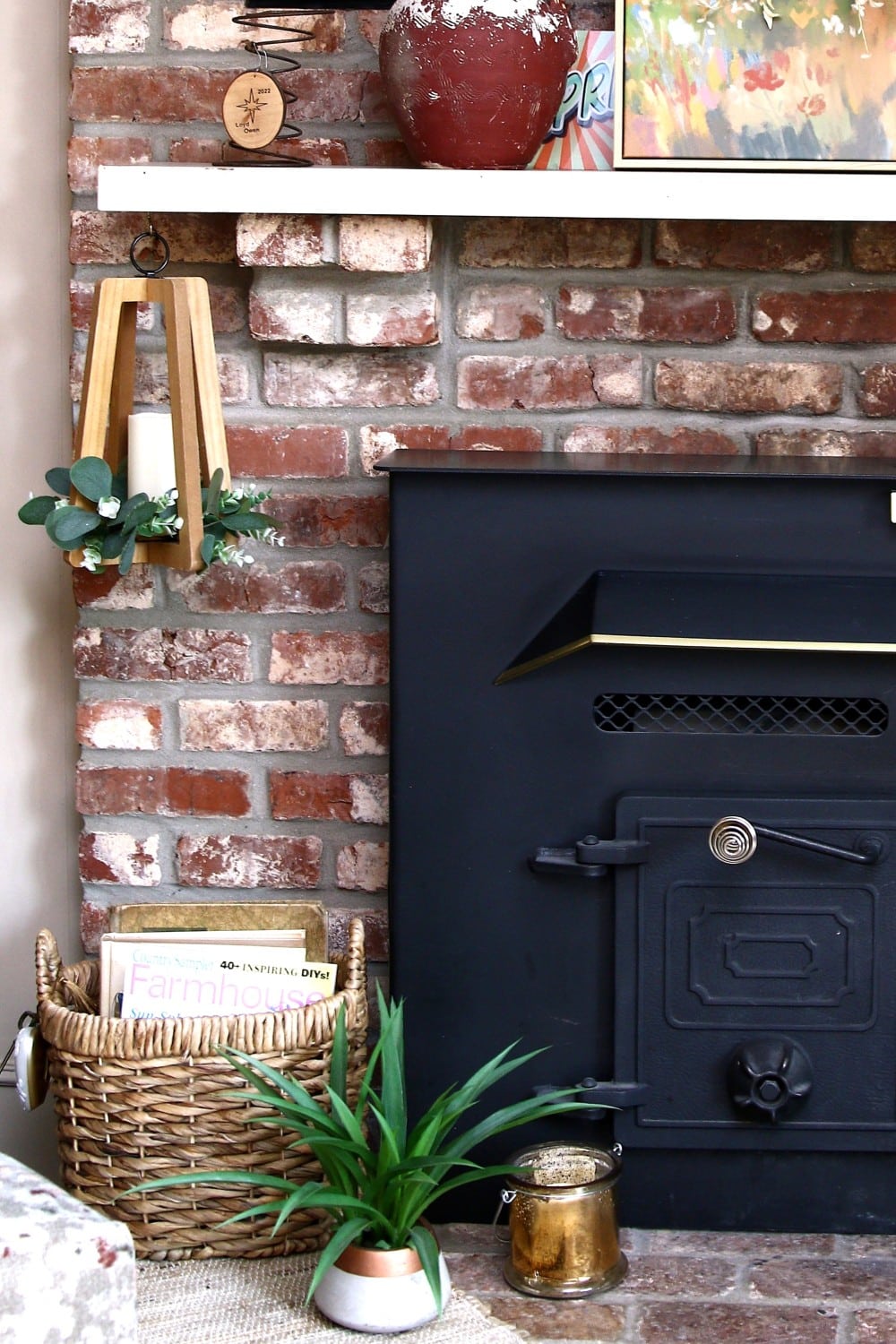 how to upcycle a hanging candle holder with a 50 cent wreath.