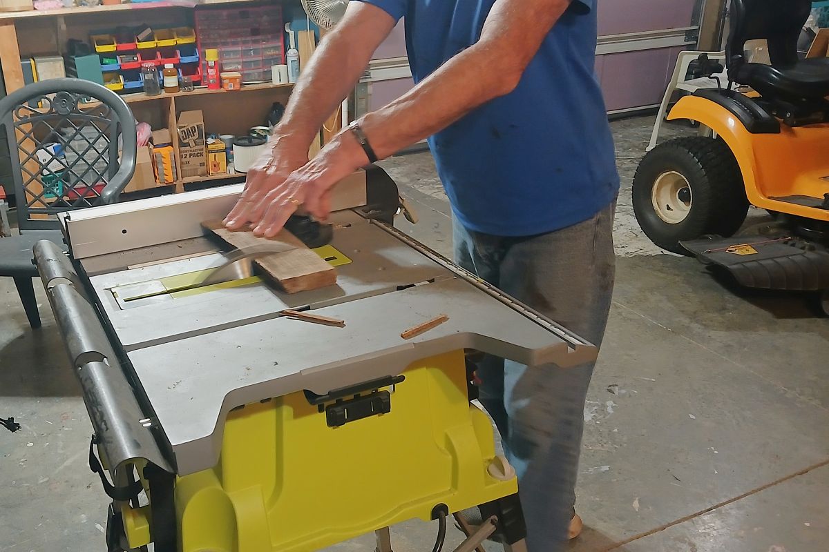 cutting wood on a table saw to make wood pumpkins